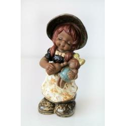 Meisje met pop vintage retro beeldje