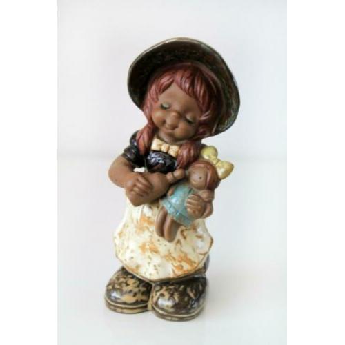 Meisje met pop vintage retro beeldje