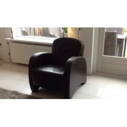 Lederen fauteuil bruin. € 50.00