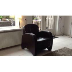 Lederen fauteuil bruin. € 50.00