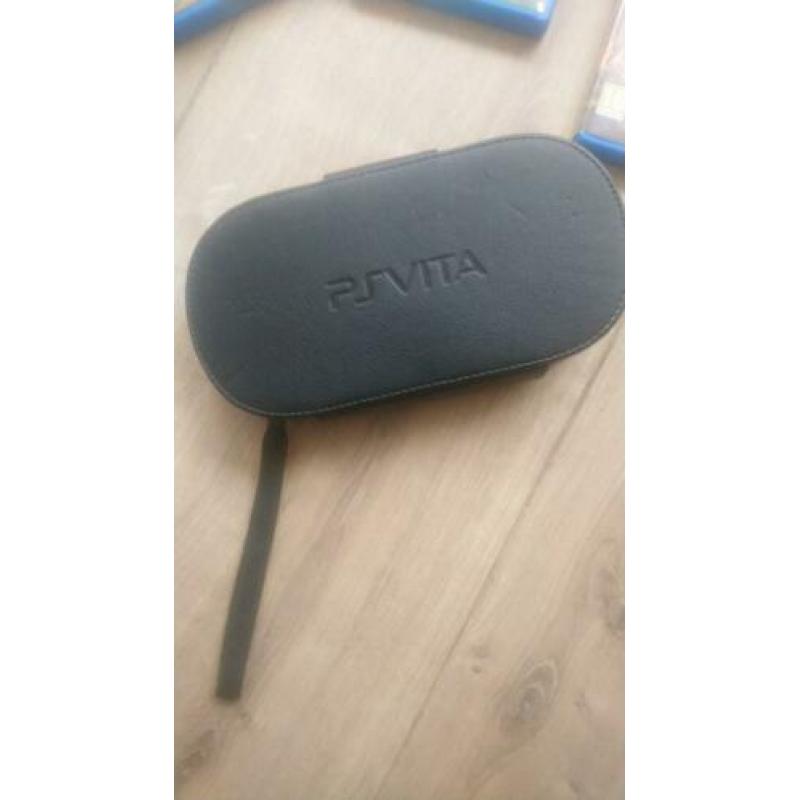 PSP Vita inclusief hoesje, oplader en drie games.