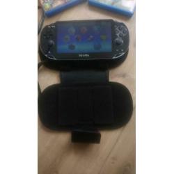 PSP Vita inclusief hoesje, oplader en drie games.