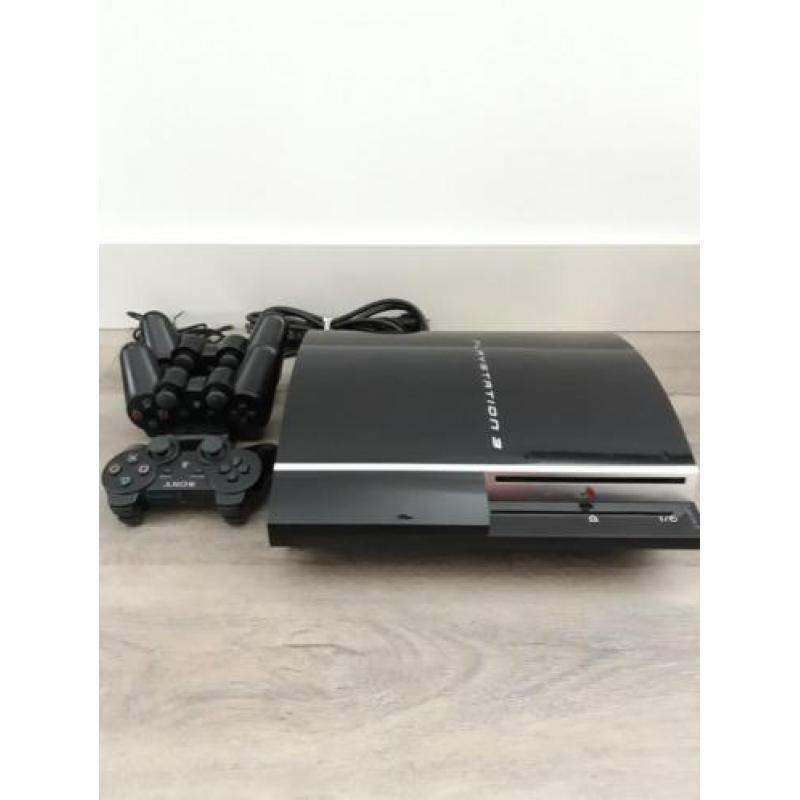 Ps 3 met 3 dual shock controllers en duo oplader 80GB